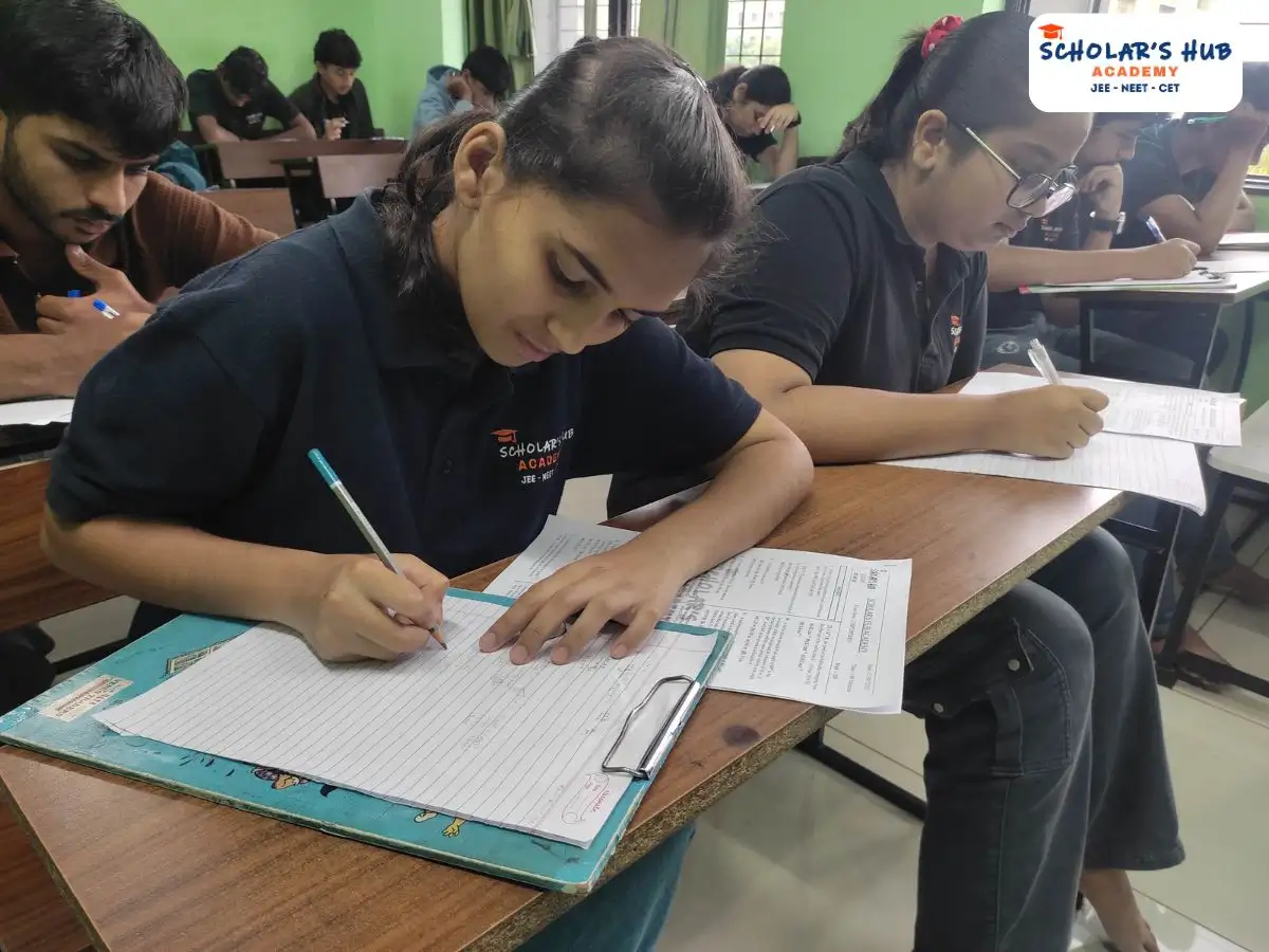 Student writing exam in NEET Classes in Pune.
