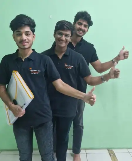 3 Students with thumbs up action.